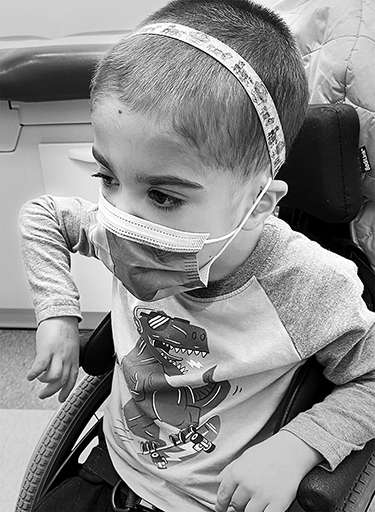 Small child with mask at Drs office