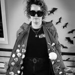 Satirical portrait of Sally with seashells inside her coat