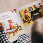 Over the shoulder view of a children's book