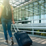 Walking with a suitcase in an airport
