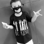 Boy with clear covid facemask