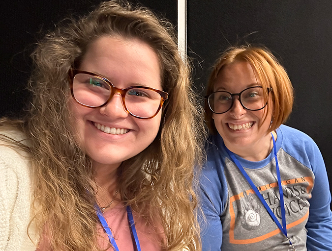 Two ladies smiling for camera