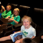 Children watching movie at a movie theater