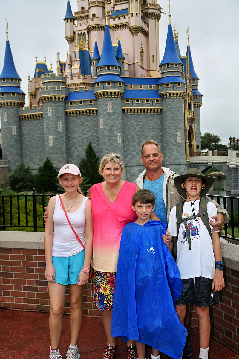 Family posing in Disney World