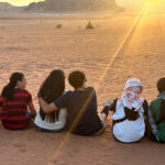 Family sitting looking at the sunset