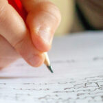Hand writing on a piece of paper