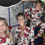 Cousins playing in pajamas