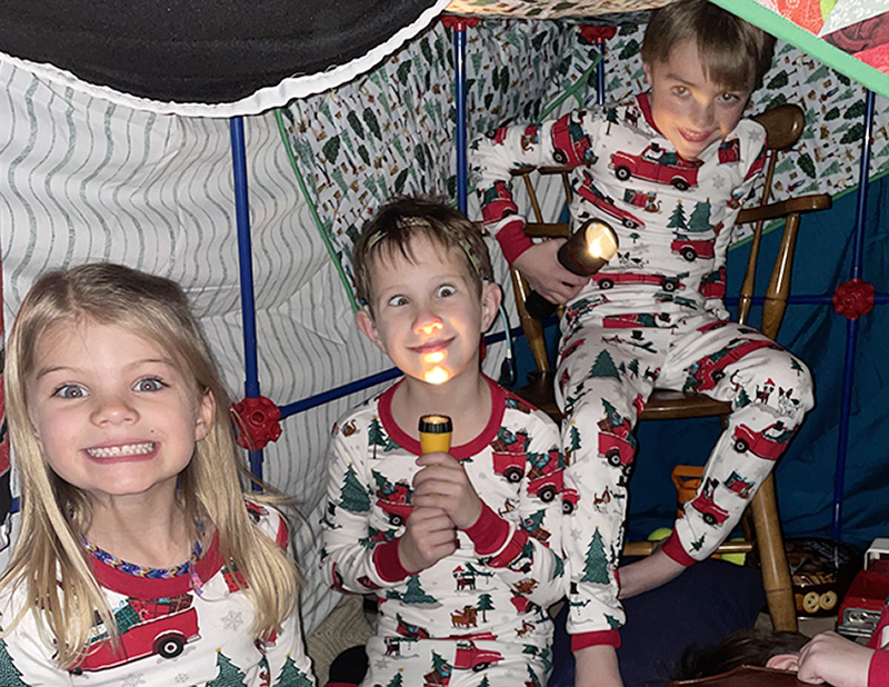 Cousins playing in pajamas