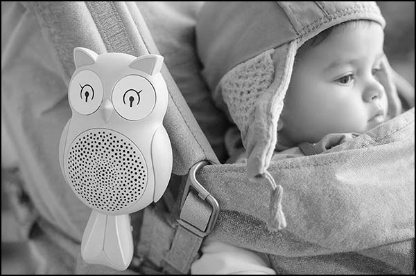 Baby in crib with sound machine