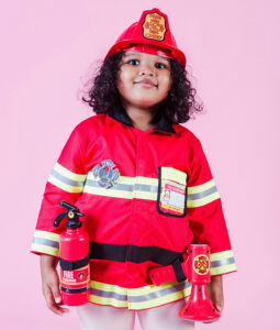 Little girl dressed as a firefighter